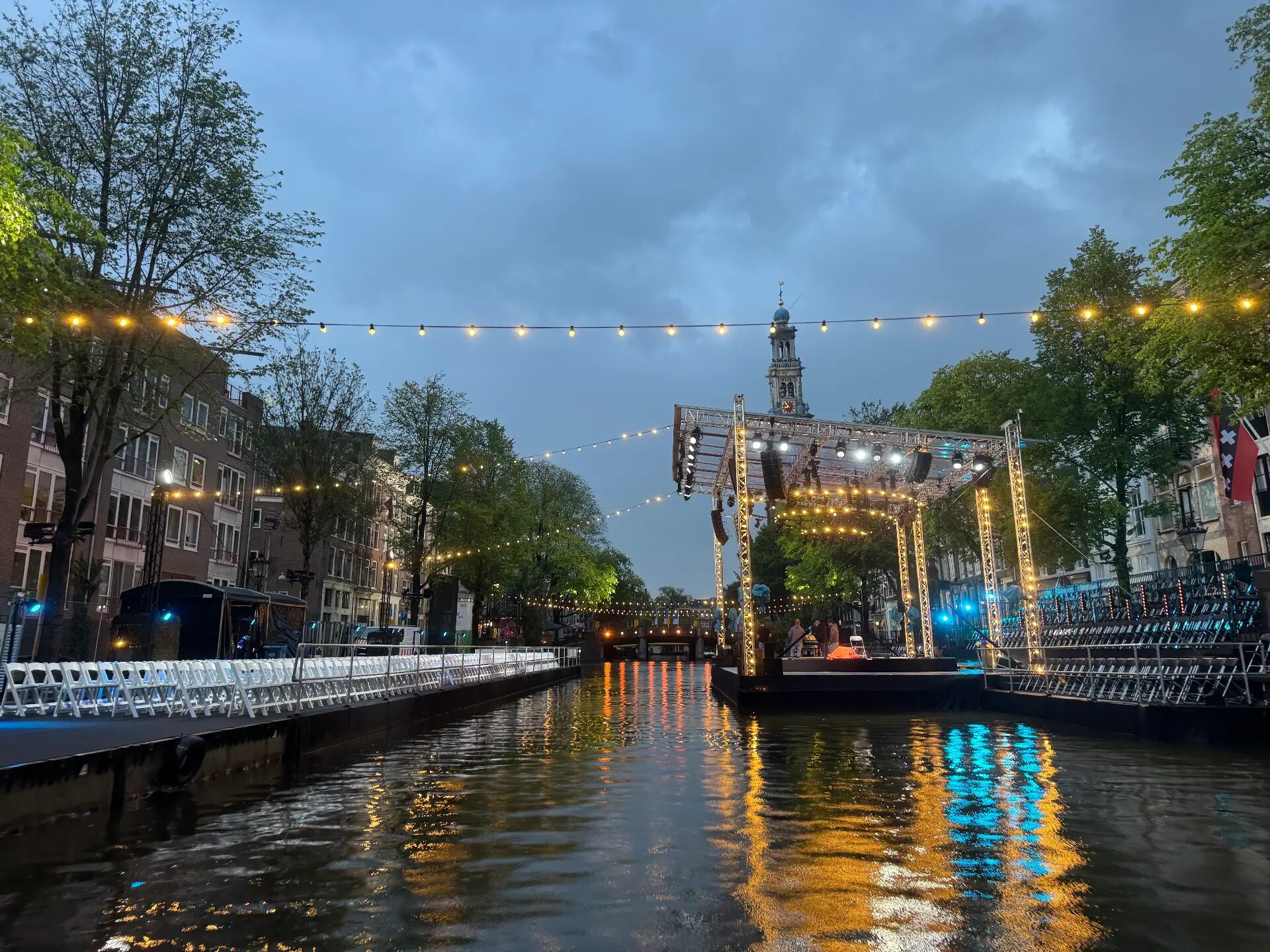 The Prinsengracht concert stage lit up over the water at dusk